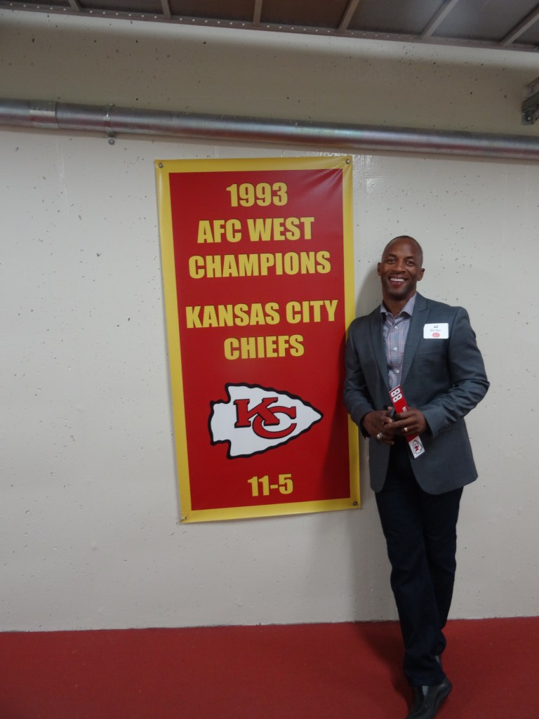 JJ Birden next to his championship team.