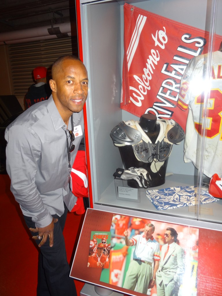 Display with JJ's old Chiefs pads and gloves at Arrowhead. 